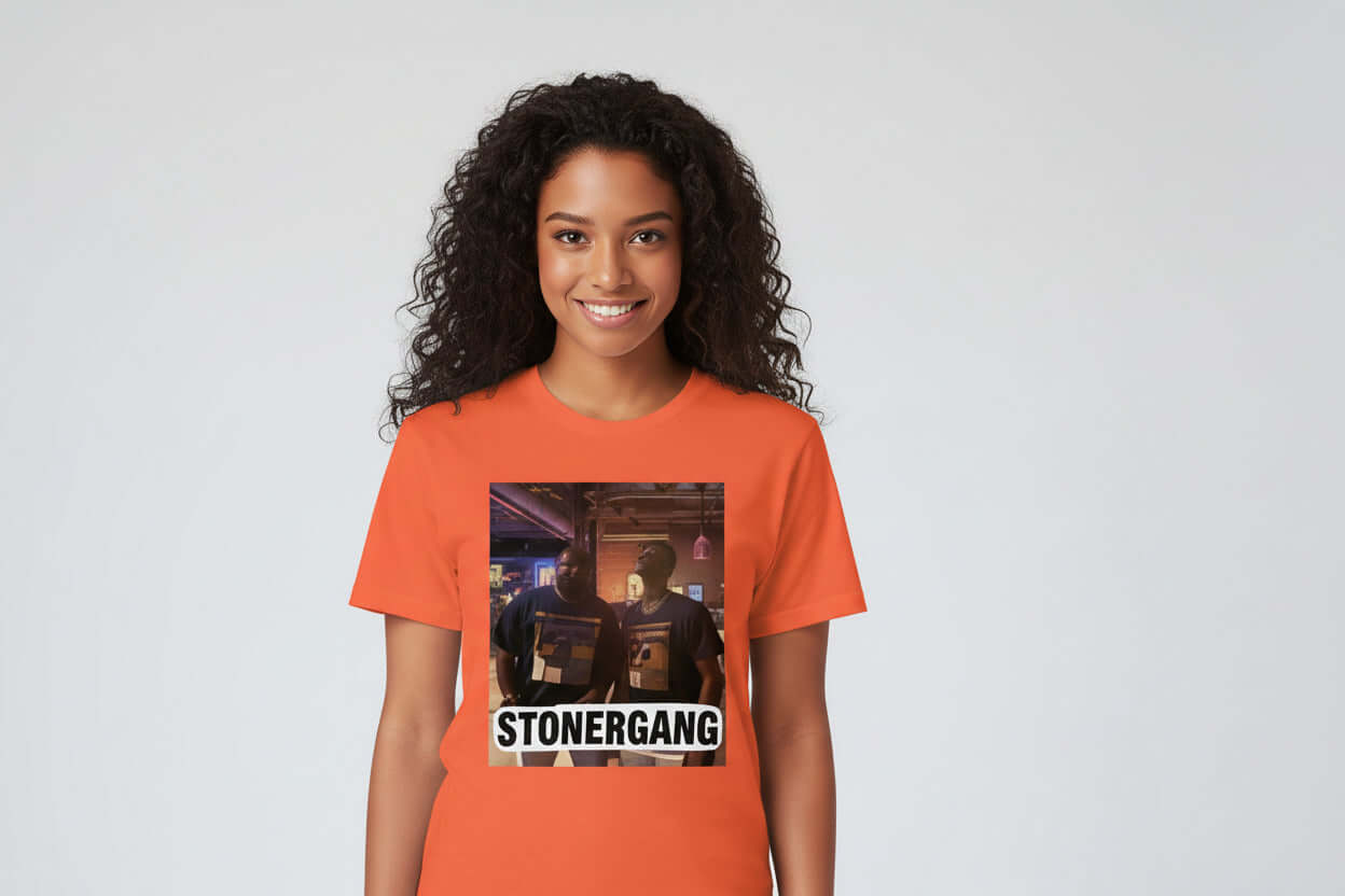 Two individuals wearing STONERKEY GTA shirts standing together in an orange setting.